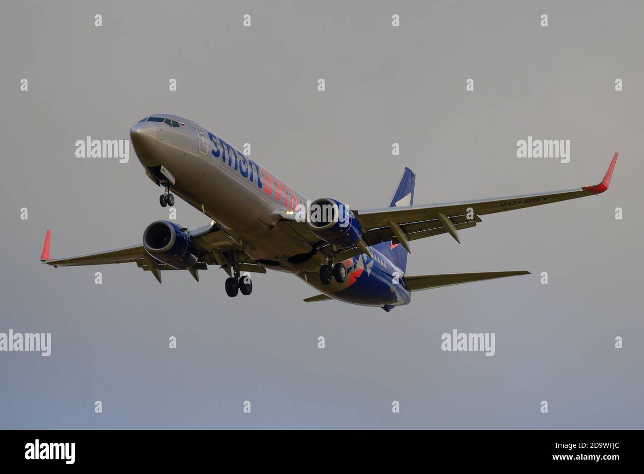 SAINT PETERSBURG, RUSSIA - OCTOBER 28, 2020: Airplane Boeing 737-800 (VQ-BBY) of Smartavia airlines on a glide path against a gray cloudy sky Stock Photo