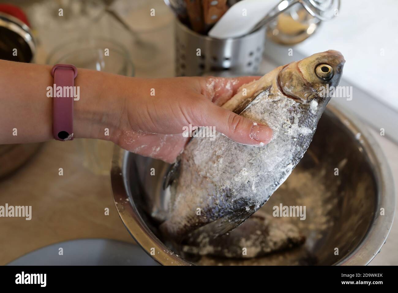 Chef dips fish in flour in kitchen Stock Photo Alamy