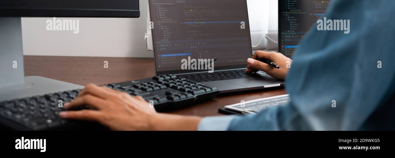 Software developer or programmer working data debugging improvement binary algorithm on desktop pc in a software develop company office Stock Photo
