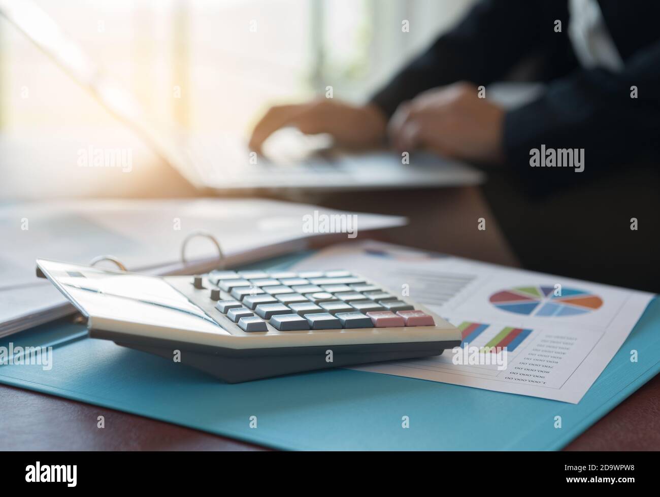 Calculator, business and financial report with the accountant using