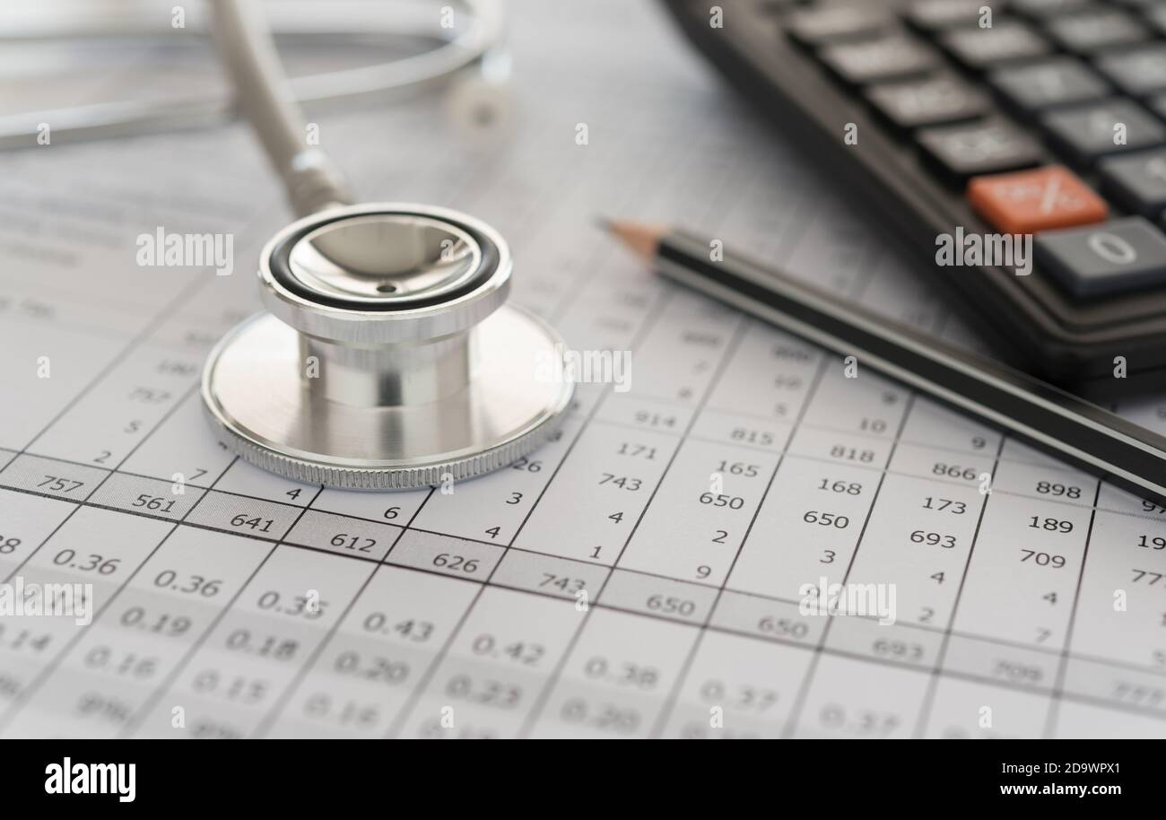 medical billing,  stethoscope and calculator on bills for health care costs or medical insurance. Stock Photo