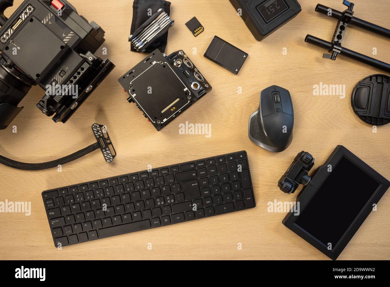 Flat lay of filming accessories with computer parts on table Stock Photo