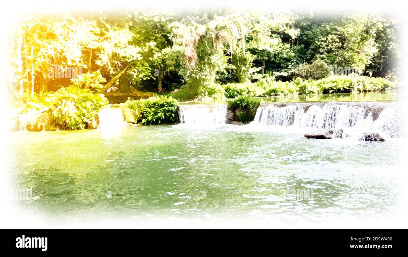 Beauty waterfall flows down from the mountains Stock Photo - Alamy