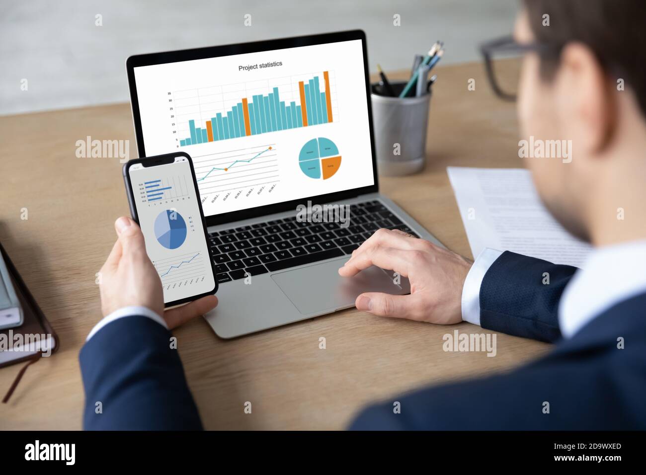 Focused young male ceo executive manager using modern technology gadgets. Stock Photo