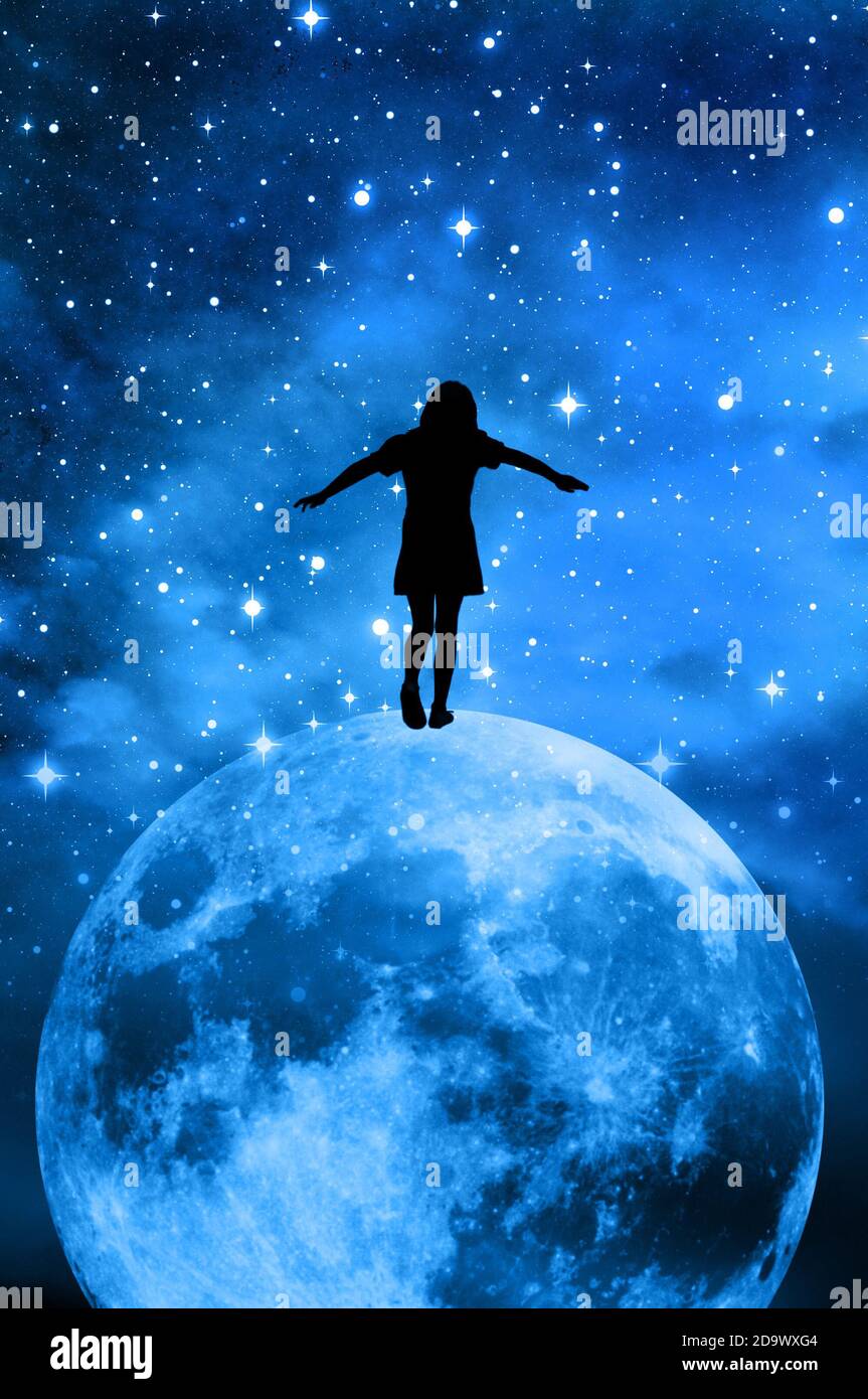 surrealistic silhouette of a girl balancing on the moon Stock Photo