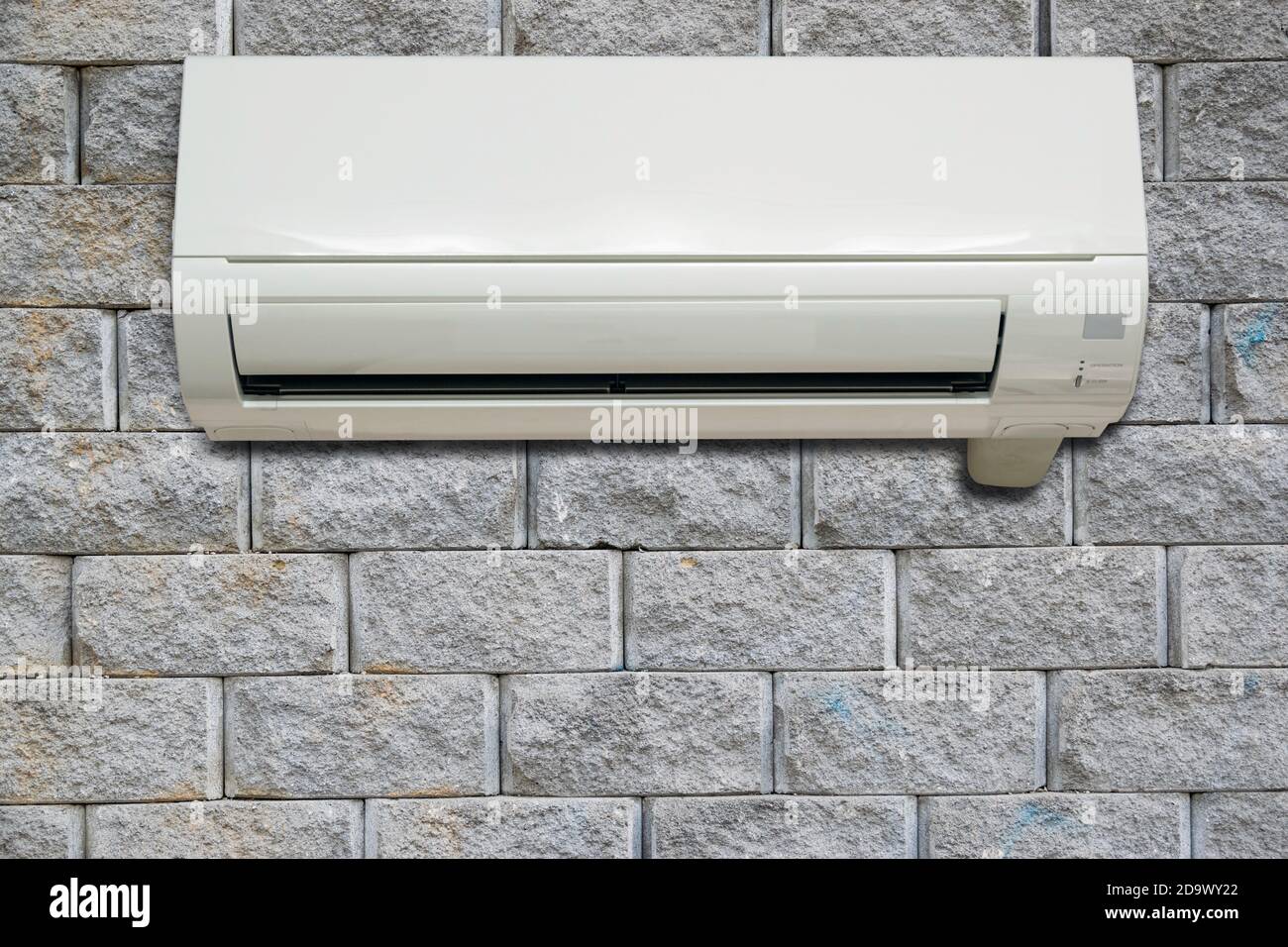 Wall air conditioning hanging on a brick wall in the bedroom Stock Photo Alamy