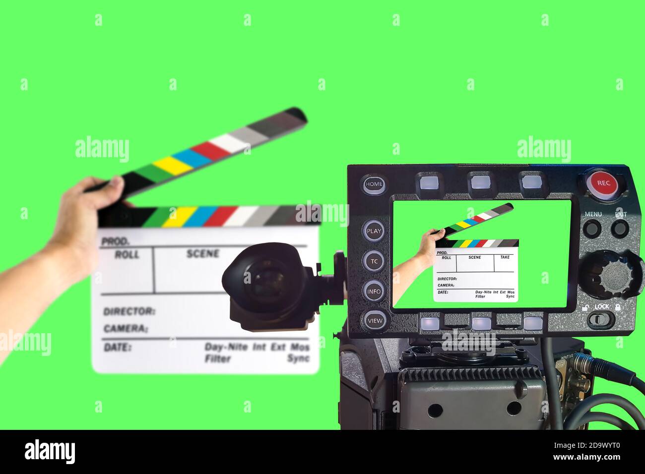 LCD monitor on the camera focus at a hand holding camera slate for the