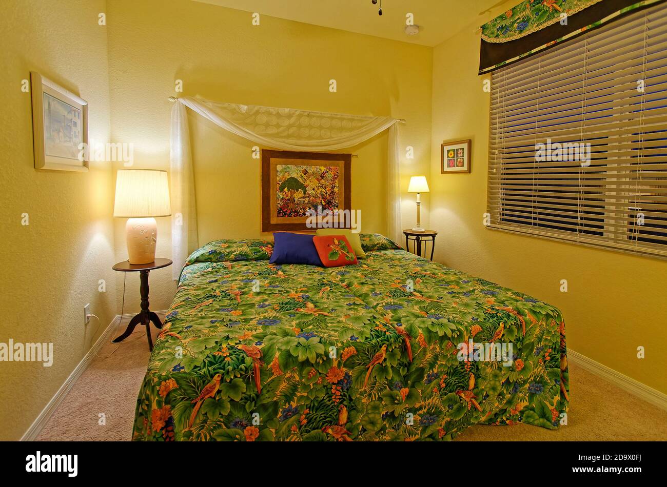 bedroom; king size bed; night tables; lamps; incandescent lighting