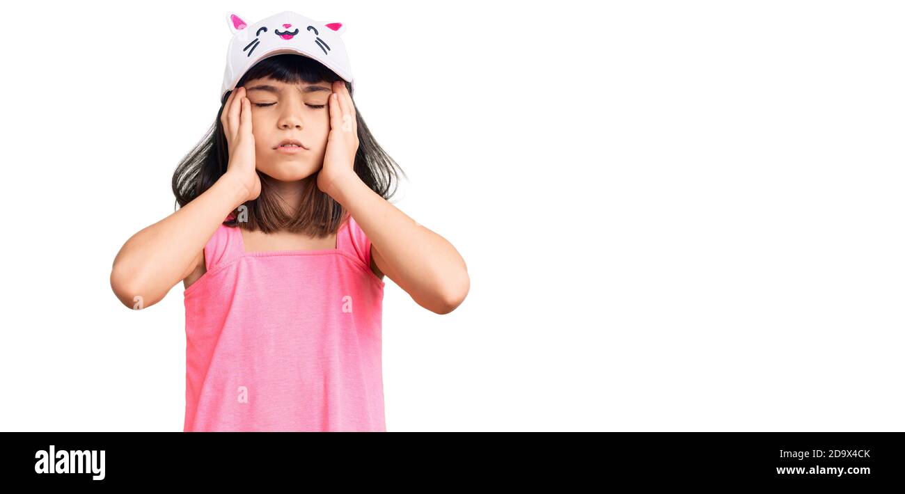 Young little girl with bang wearing funny kitty cap suffering from