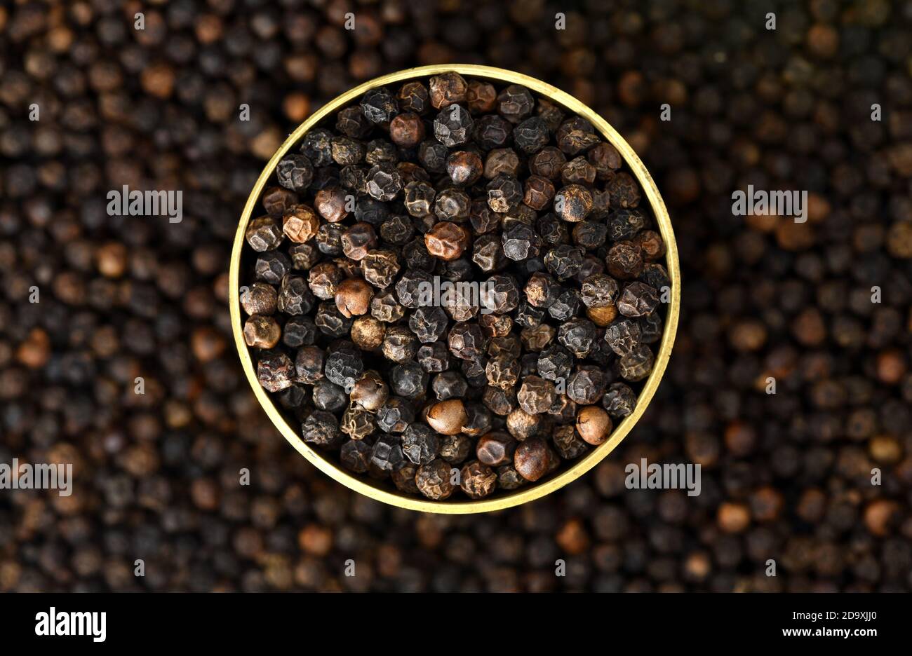 Close up one bowl full of black pepper peppercorns. Black pepper “king of spices” is one of the