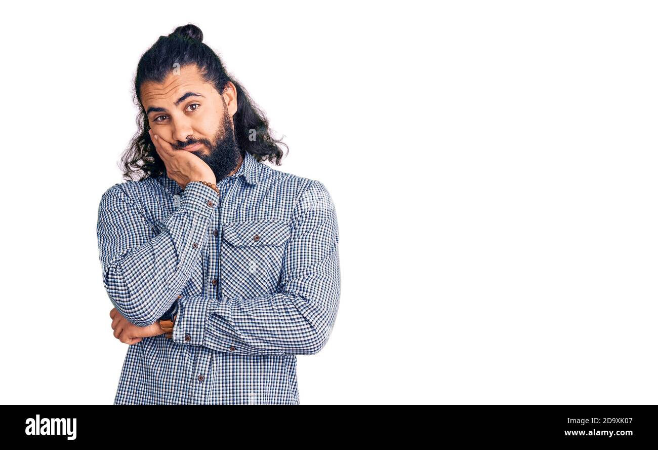 Young arab man wearing casual clothes thinking looking tired and bored ...