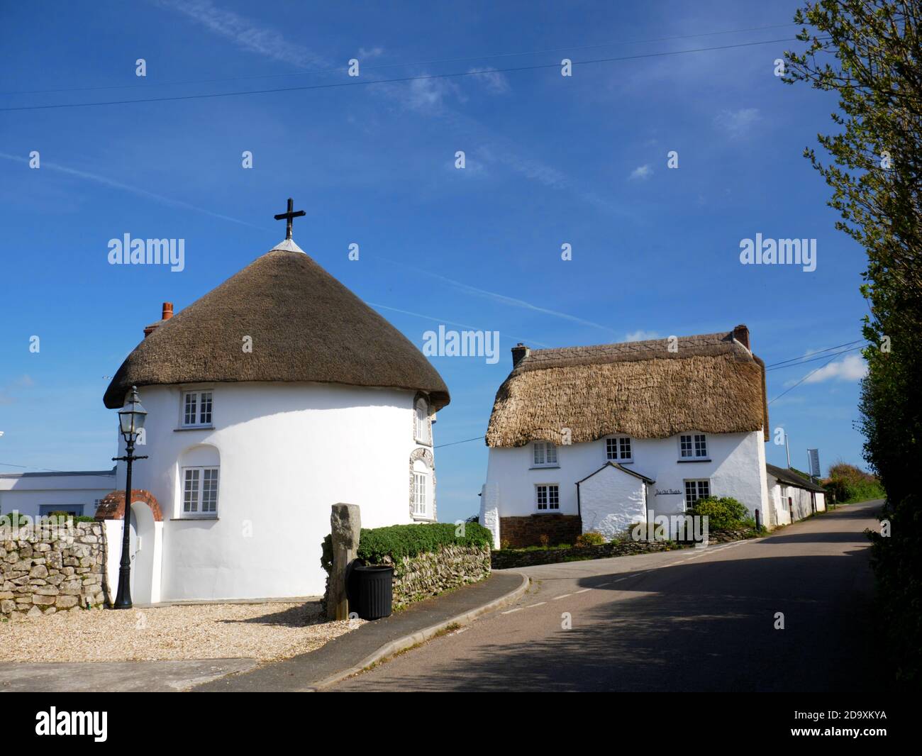 Veryan: one of a pair of roundhouses built as lodge cottages at the Veryan Green (east) end of the village. Stock Photo