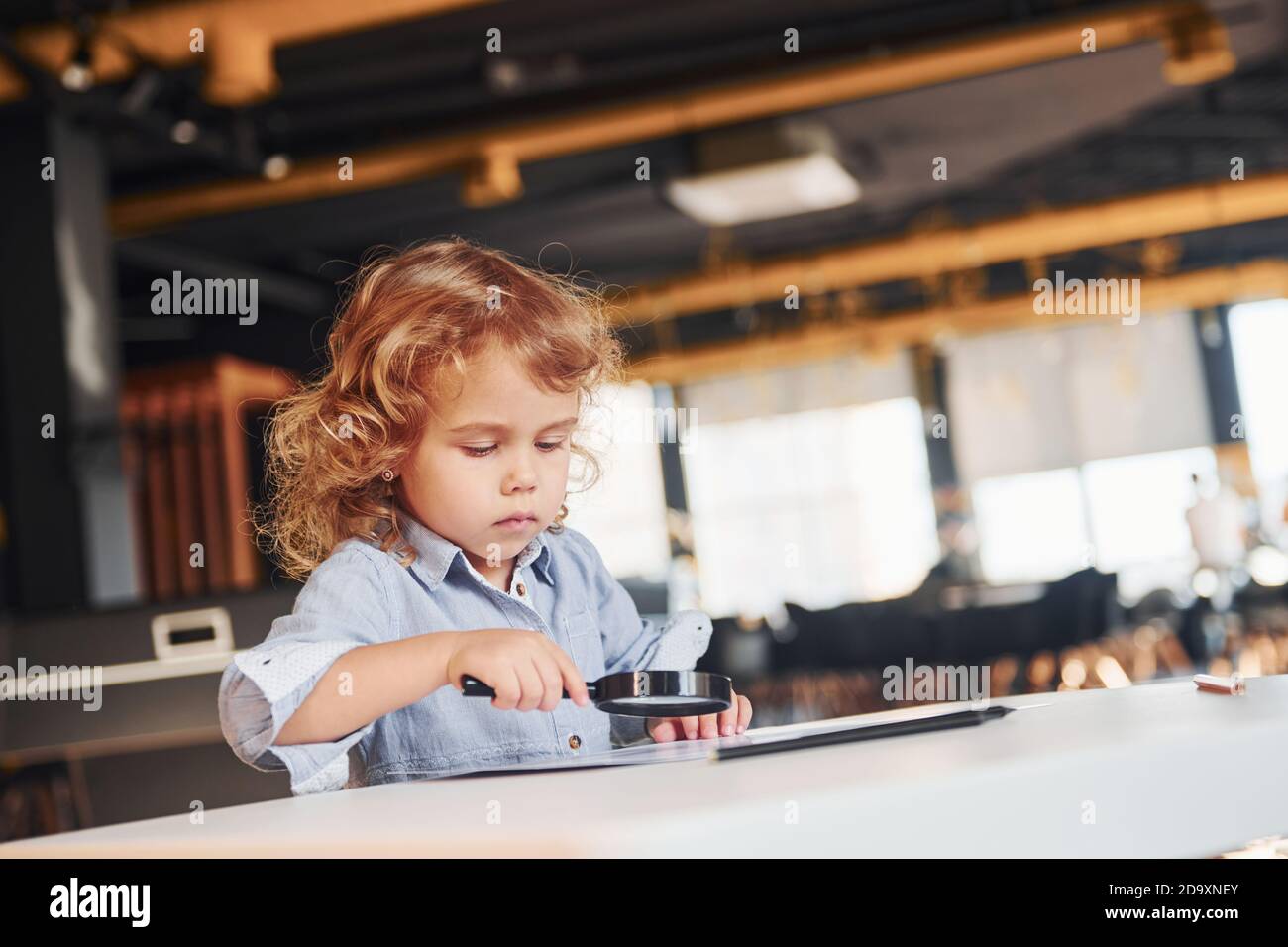 Child have fun in playroom. Kindergarten educational games Stock Photo