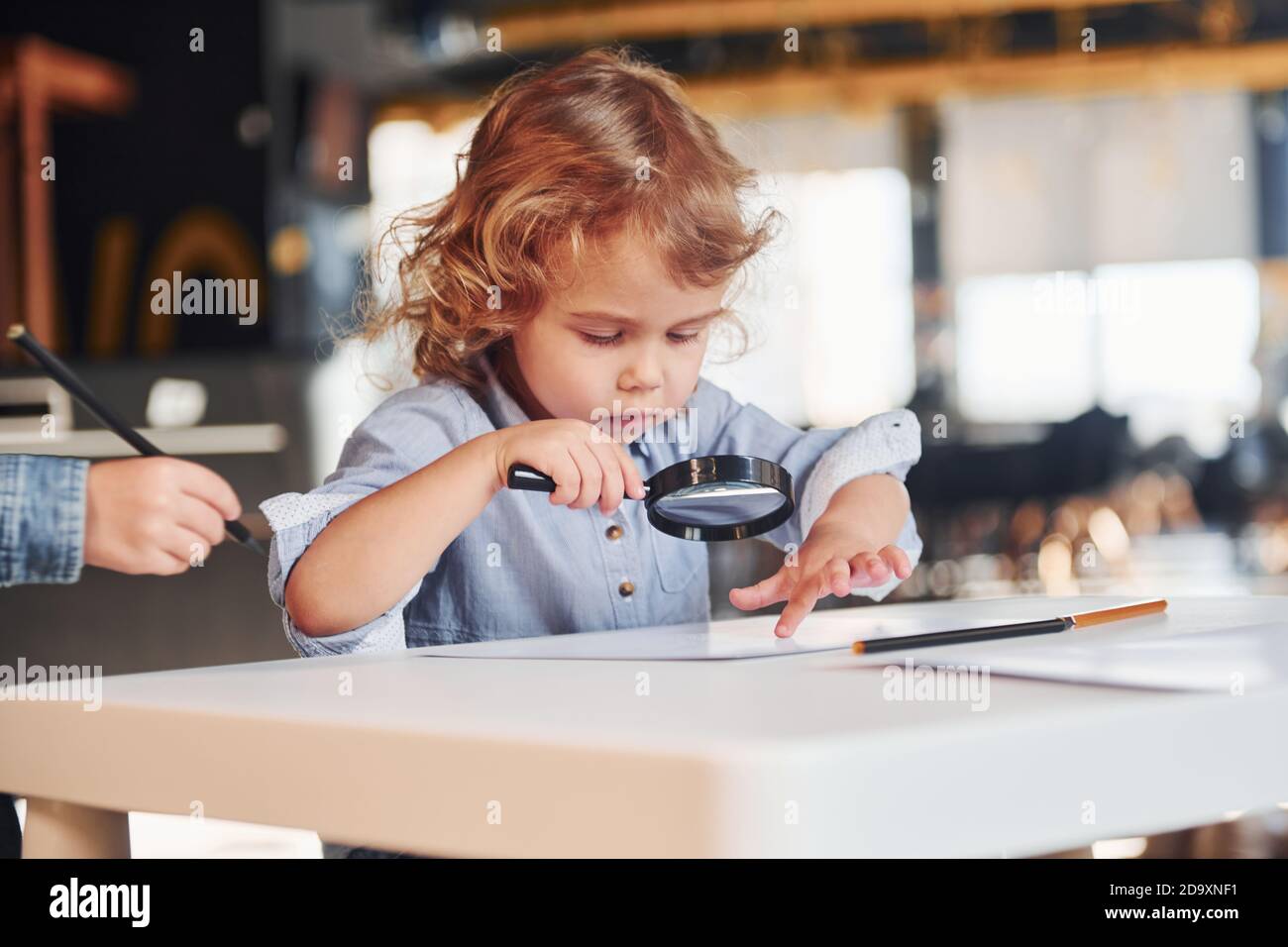 Child have fun in playroom. Kindergarten educational games Stock Photo