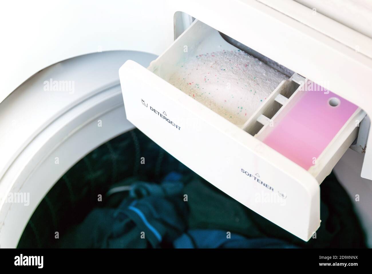 Closeup of the detergent and fabric softener in the washing machine Stock  Photo - Alamy