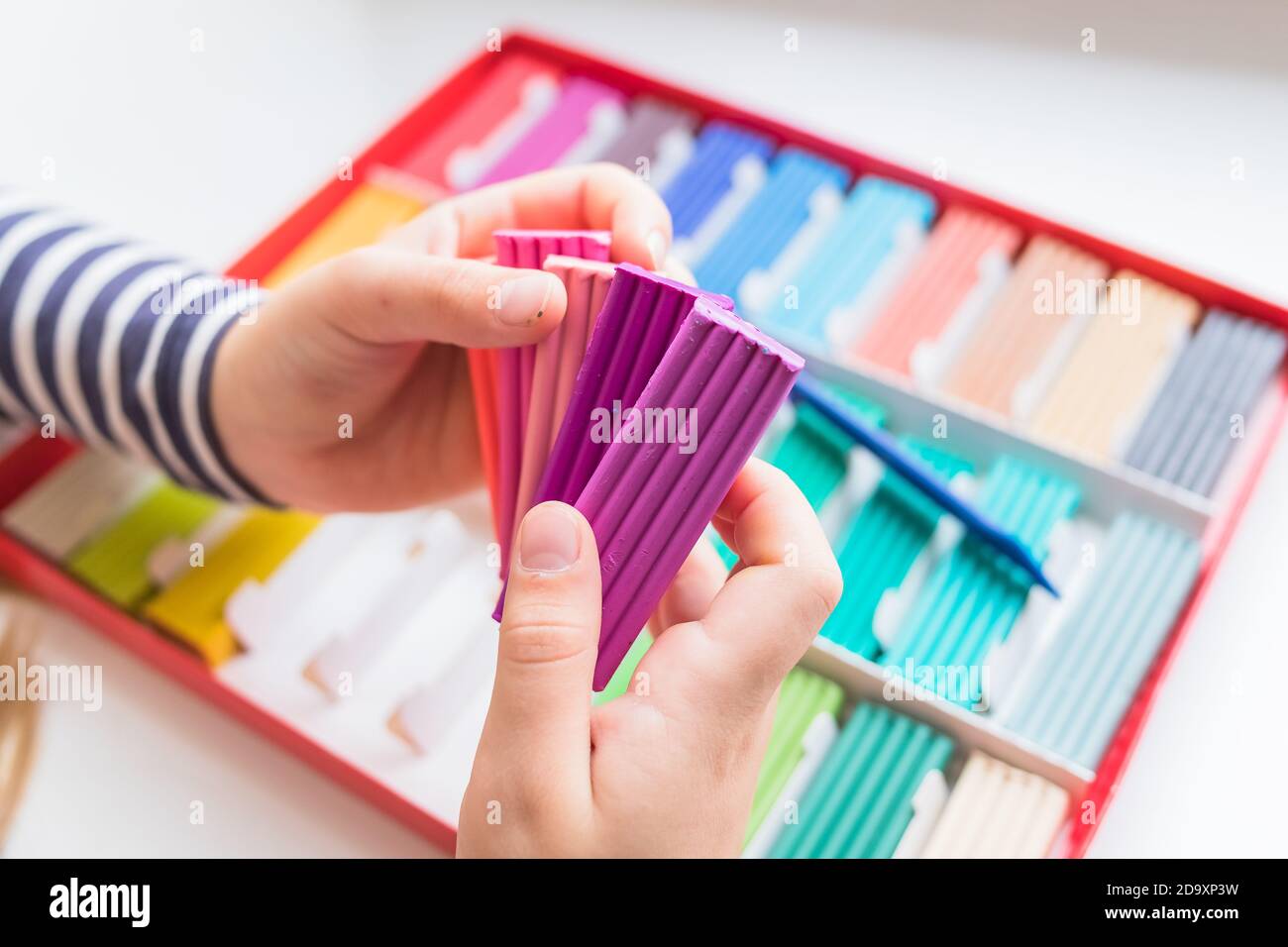 Rainbow colors plasticine box isolated on white background.Colorful kid
