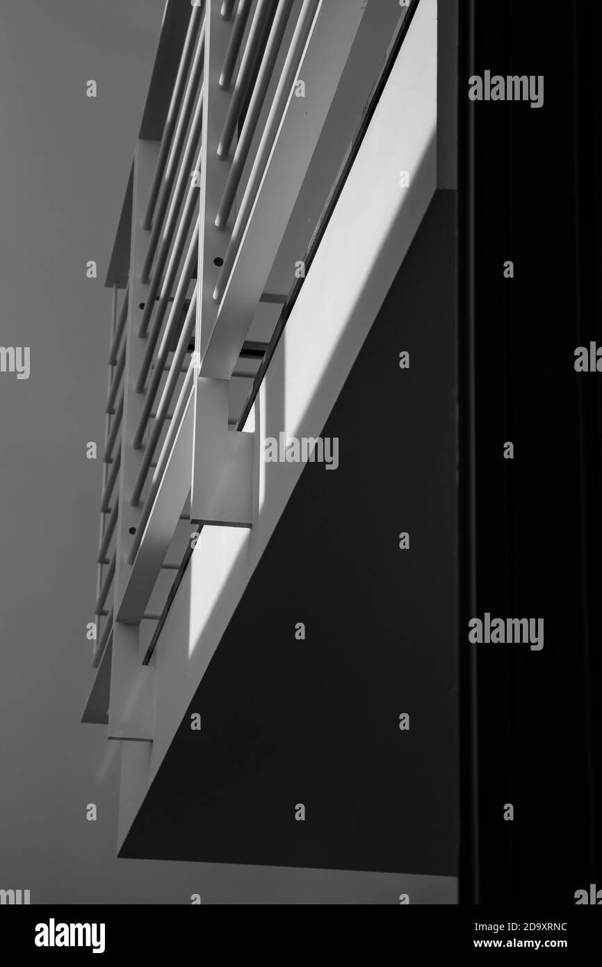 Vertical grayscale low-angle shot of a modern building Stock Photo - Alamy