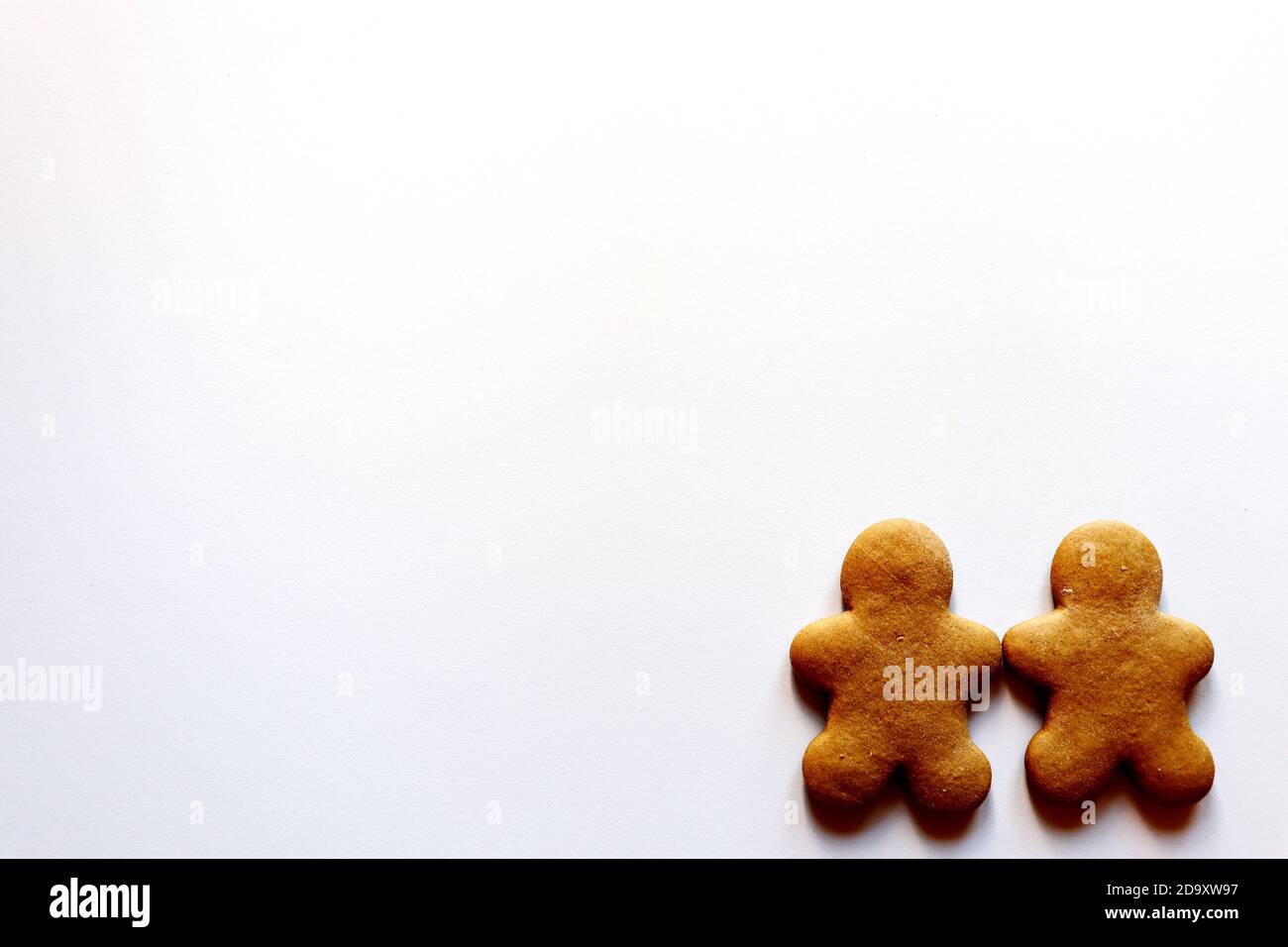 Two gingerbread men on a white background Stock Photo
