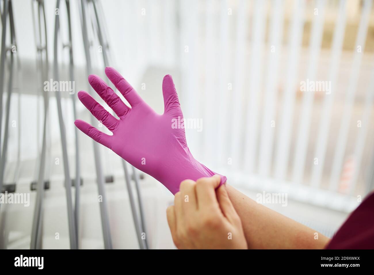 Dentist wearing protective gloves hires stock photography and images