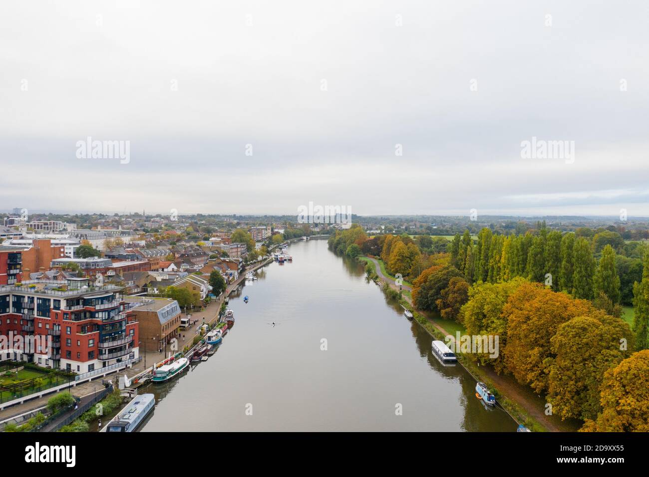 Aerial Landscape View Over a River in the Middle of a Town and a Forest ...