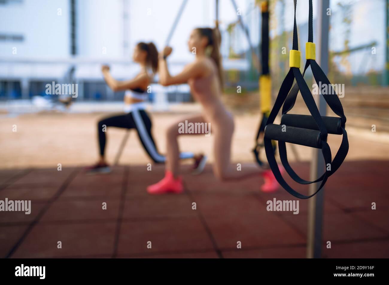 Women doing stretching exercise, group training Stock Photo