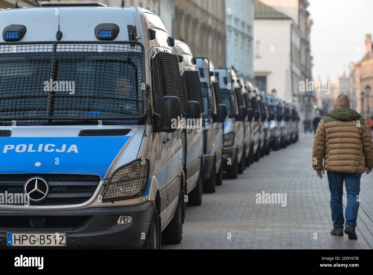Krakow, Poland. 7 November, 2020.  A line of Police vans seen during a Pro-Choice protest in Krakow's Old Town. Pro-Choice and women's rights activists and their supporters organised on Saturday evening another anti-government protest in Krakow to express their anger at the Supreme Court ruling in relation to abortion laws.. Credit: ASWphoto/Alamy Live News Stock Photo