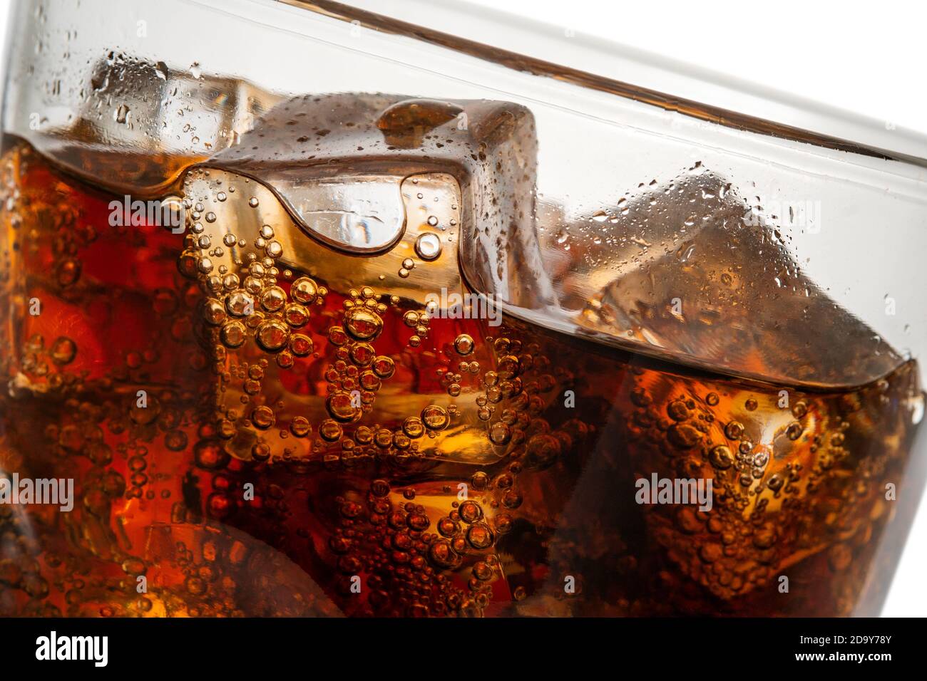 Beautiful cola with ice cubes close up in glass Stock Photo - Alamy