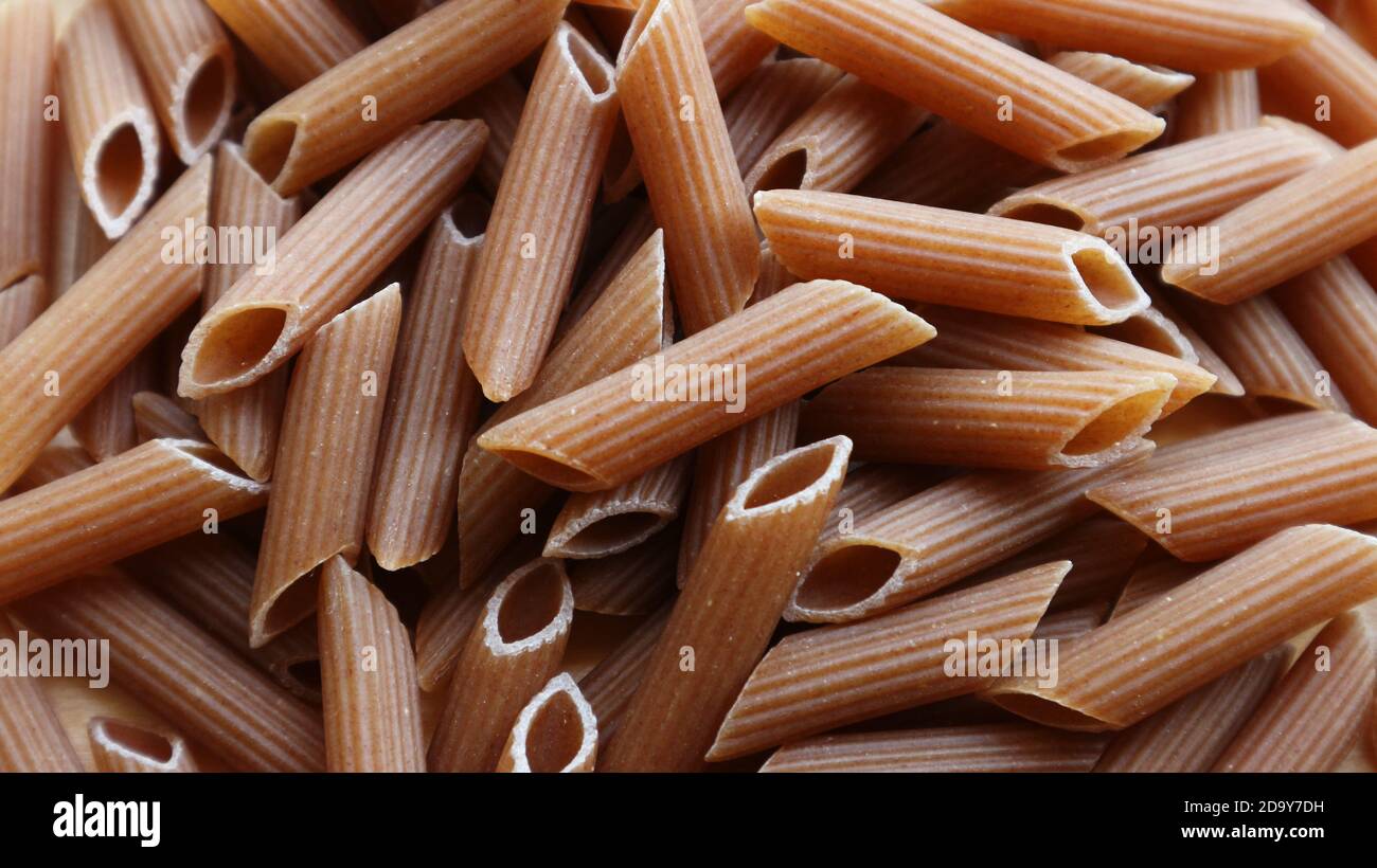Wholewheat brown penne pasta Stock Photo