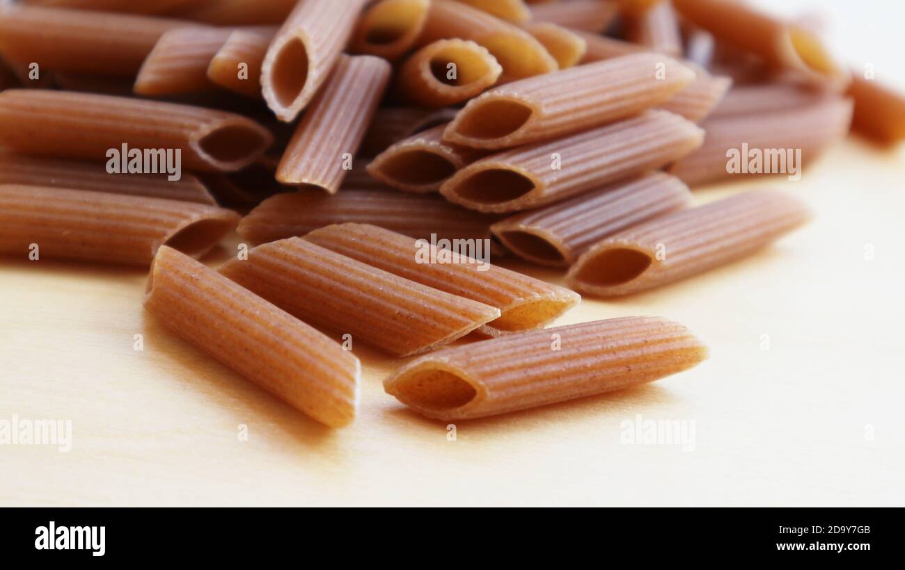 Wholewheat brown penne pasta Stock Photo