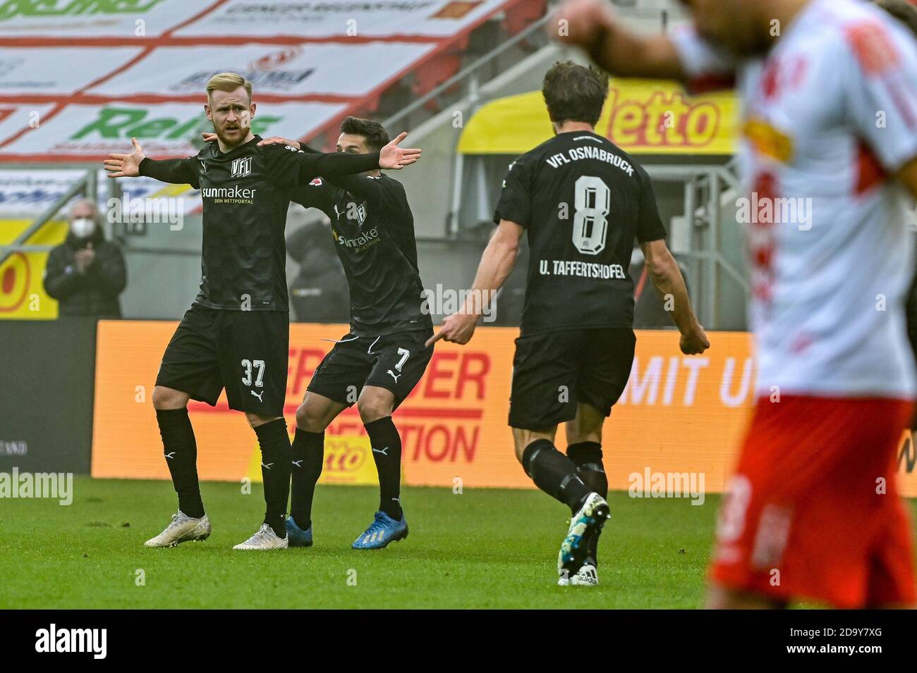 Regensburg, Germany. 08th Nov, 2020. Football: 2nd Bundesliga, Jahn Regensburg - VfL Osnabrück, 7th matchday. Sebastian Kerk von Osnabrück (l) cheers with his team mates Bashkim Ajdini (M) and Ulrich Taffertshofer after his goal to 1:2 against Regensburg. Credit: Armin Weigel/dpa - IMPORTANT NOTE: In accordance with the regulations of the DFL Deutsche Fußball Liga and the DFB Deutscher Fußball-Bund, it is prohibited to exploit or have exploited in the stadium and/or from the game taken photographs in the form of sequence images and/or video-like photo series./dpa/Alamy Live News Stock Photo