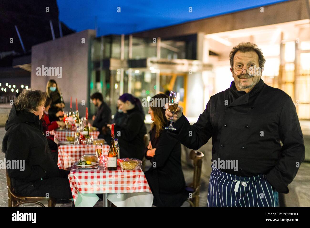 Chez Jules restaurant owner Pierre Levicky and staff serve couples a