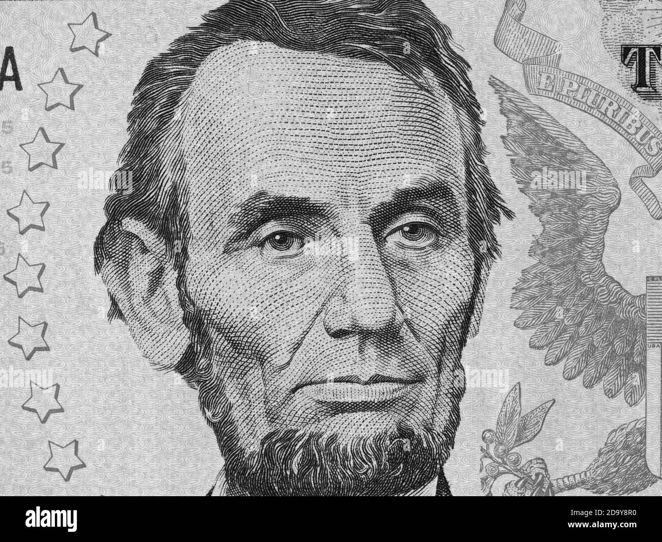 Abe Lincoln face on us five dollar bill close up macro, 5 usd, united states money closeup Stock Photo