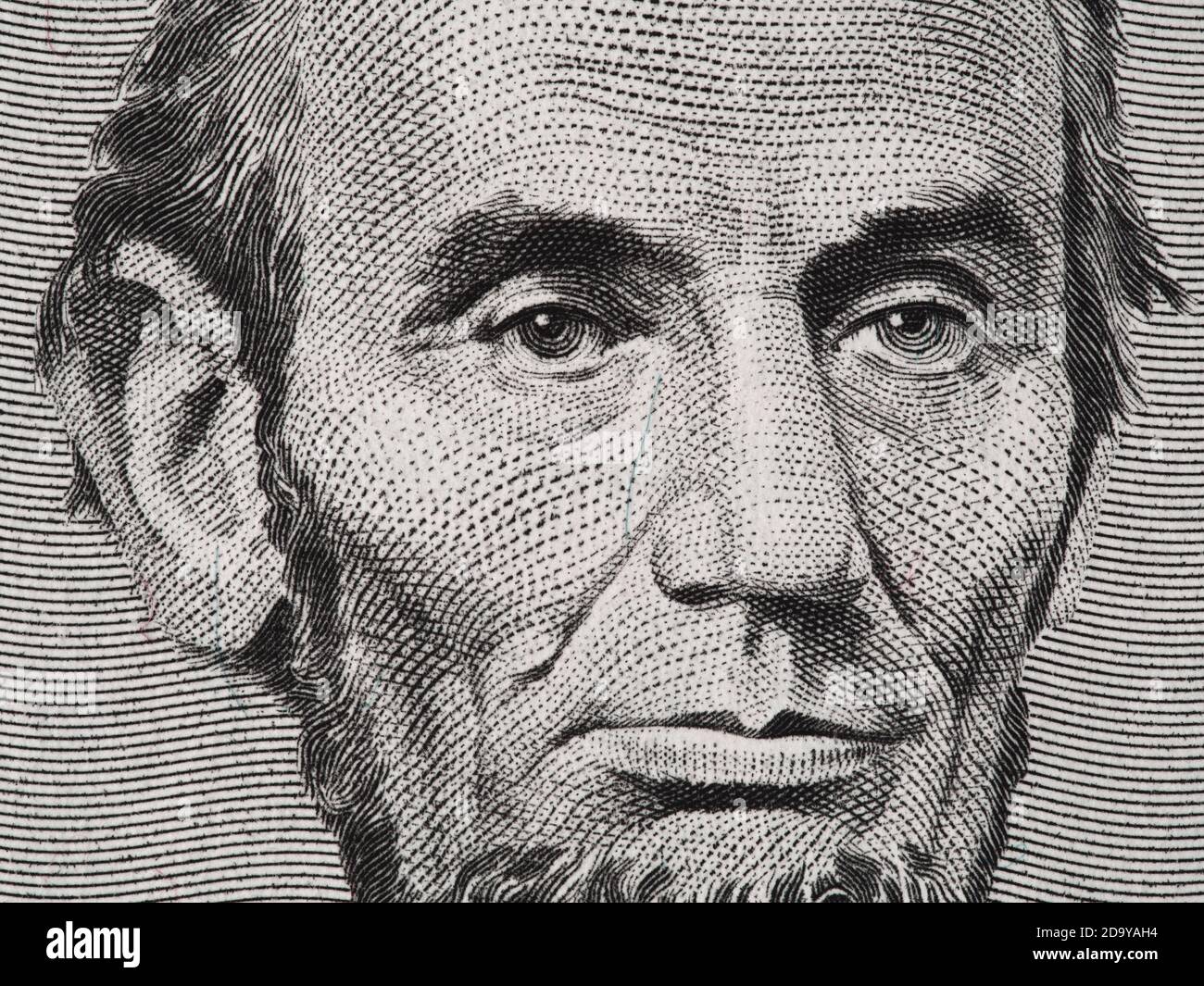 President Abraham Lincoln face on us five dollar bill macro, 5 usd, united states money closeup Stock Photo