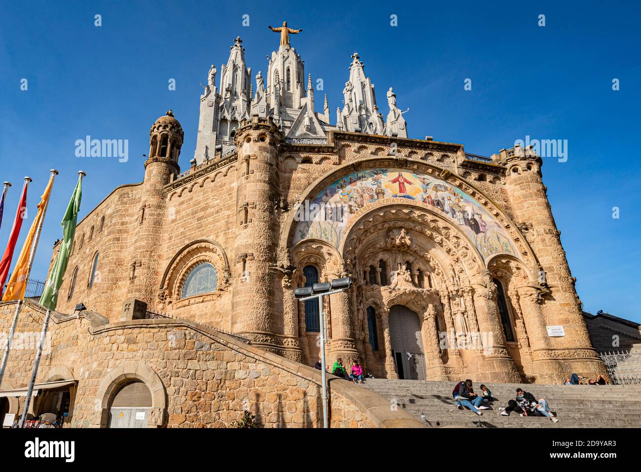 BARCELONA, SPAIN - NOV 07: People relaxing in front of Tibidabo church on mountain in Barcelona Stock Photo