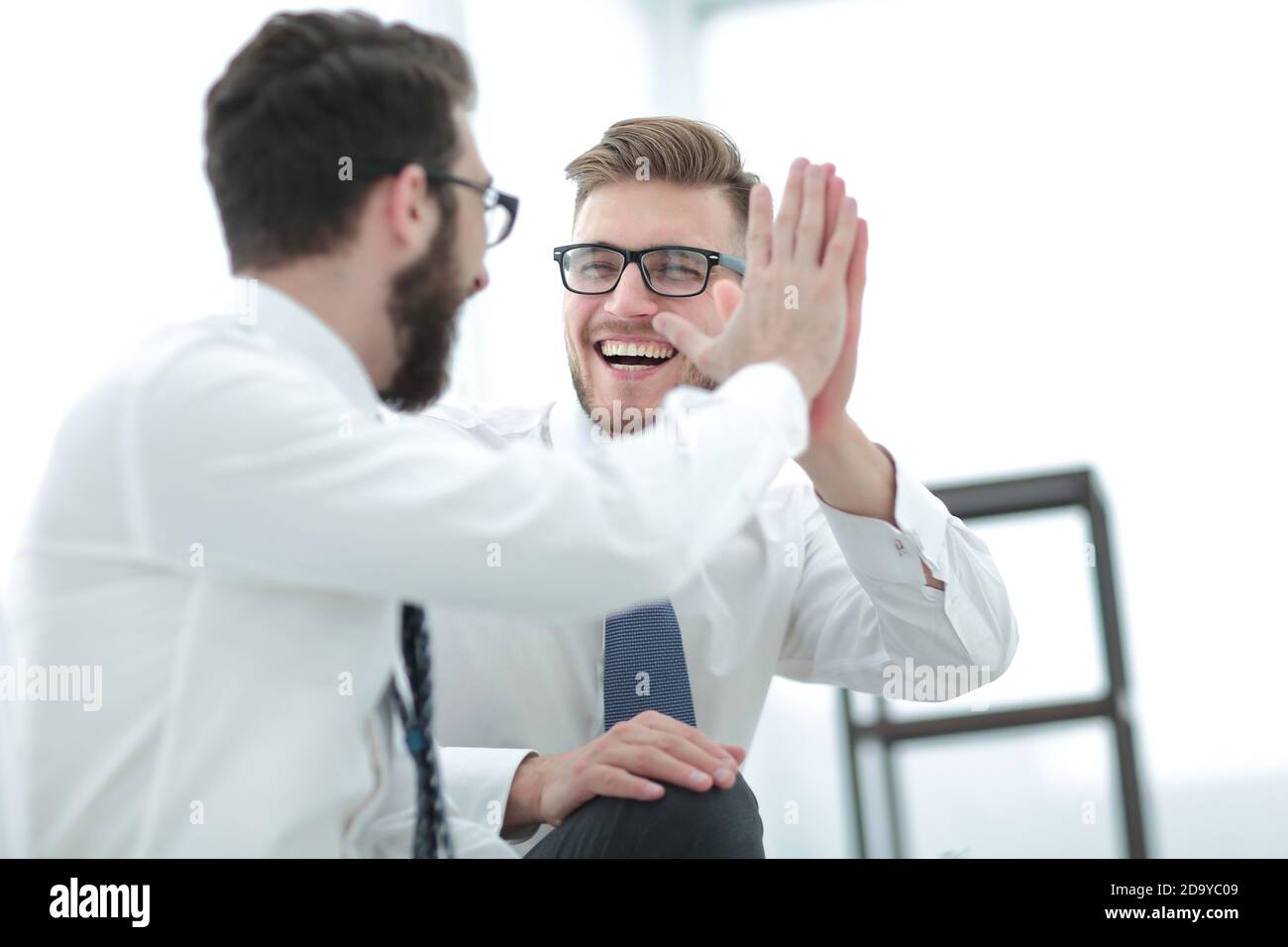 close up. two successful employees giving each other a high five Stock ...