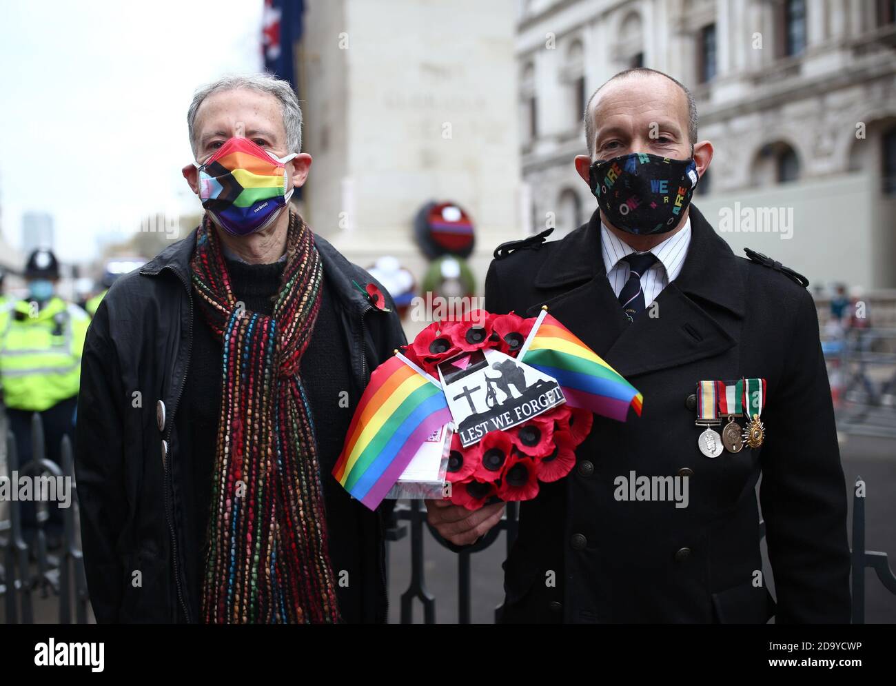 Royal Air Force veteran David Bonney (right) and human rights campaigner Peter Tatchell lay a rainbow wreath at the Cenotaph, in Whitehall, London, following the Remembrance Sunday service. Stock Photo
