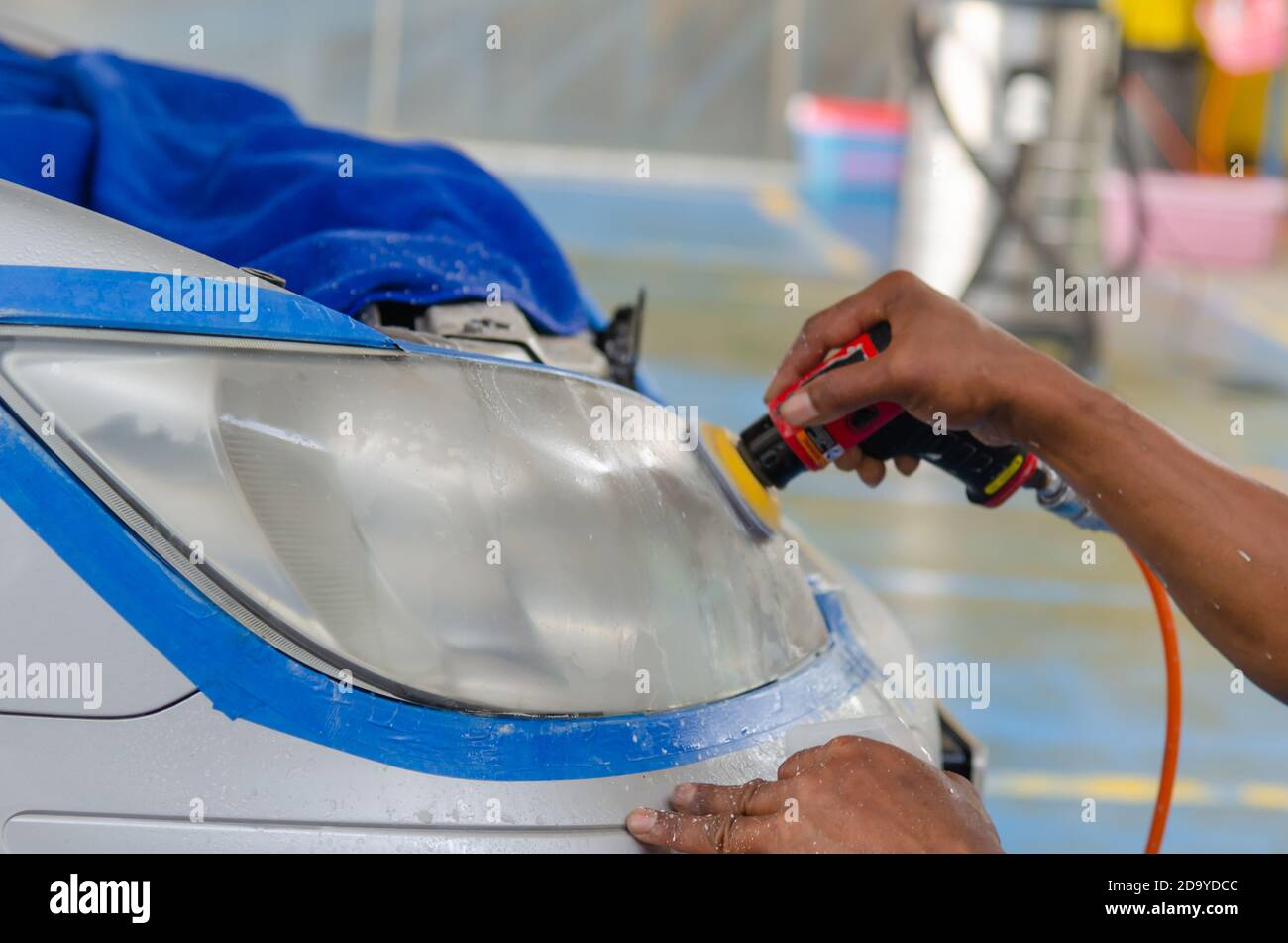Car headlight cleaning polishing machine at car service Stock Photo Alamy