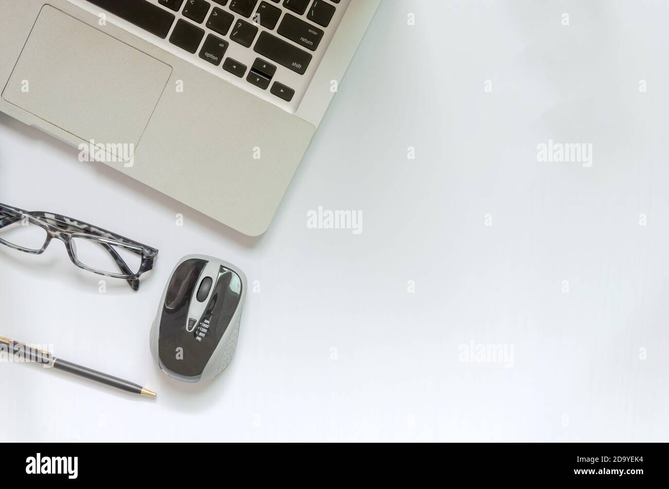 Top view Computer, pen, mouse and glasses on white background. copy space Stock Photo