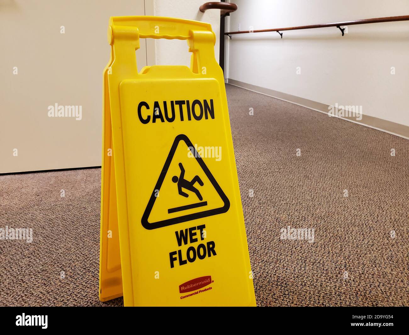 Closeup of Caution Wet Floor sign from Rubbermaid in commercial