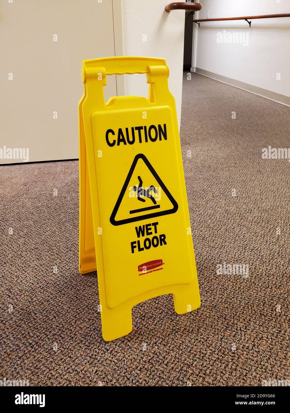 Closeup of Caution Wet Floor sign from Rubbermaid in commercial