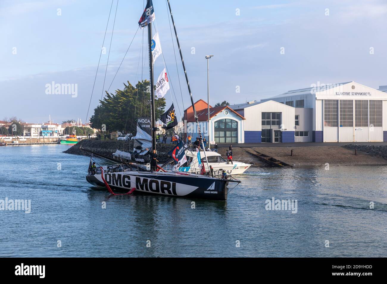 LES SABLES D'OLONNE, FRANCE - NOVEMBER 08, 2020: Kojiro Shiraishi boat (DMG Mori) in the channel for the start of the Vendee Globe 2020 Stock Photo