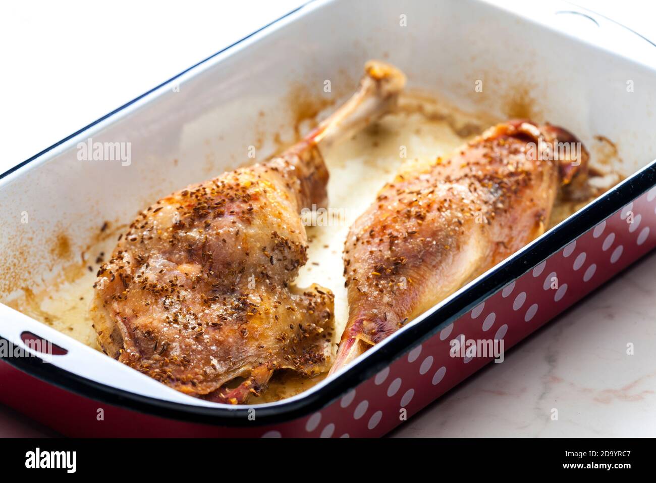 baked goose legs with cumin in frying pan Stock Photo Alamy