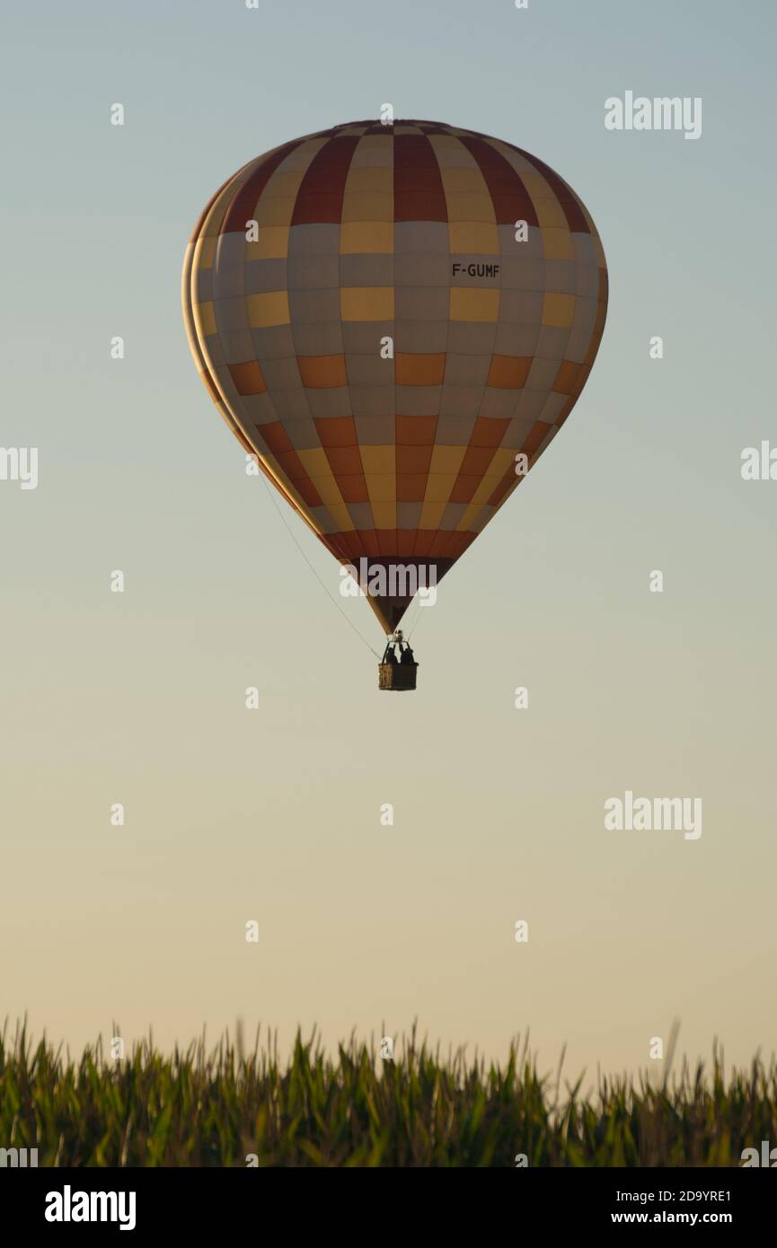 Hot air balloon (Montgolfier) flying over the Dropt valley between Duras and Eymet Stock Photo