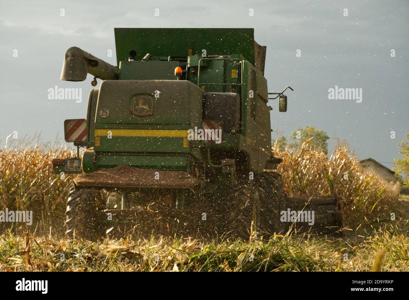 Combine harvester harvesting maize in the Dropt valley near Duras, Lot-et-Garonne, France Stock Photo