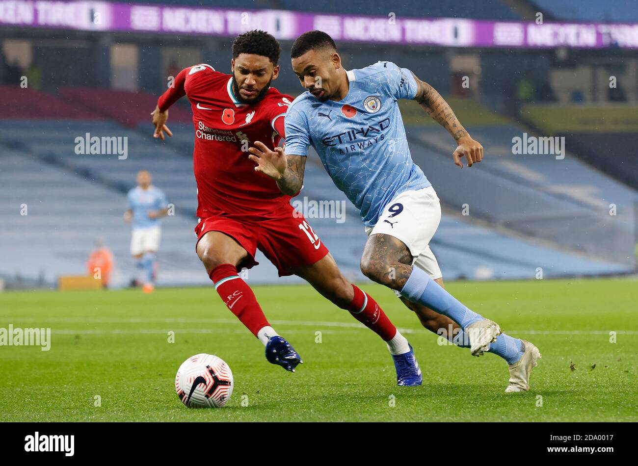 Liverpool's Joe Gomez (left) and Manchester City's Gabriel Jesus battle for the ball during the Premier League match at the Etihad Stadium, Manchester. Stock Photo