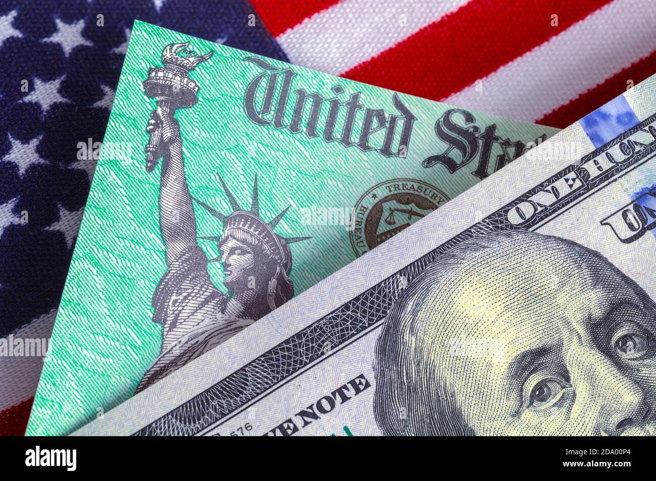 One Hundred Dollar Bill with Tax Retrun Check and American Flag. Stock Photo
