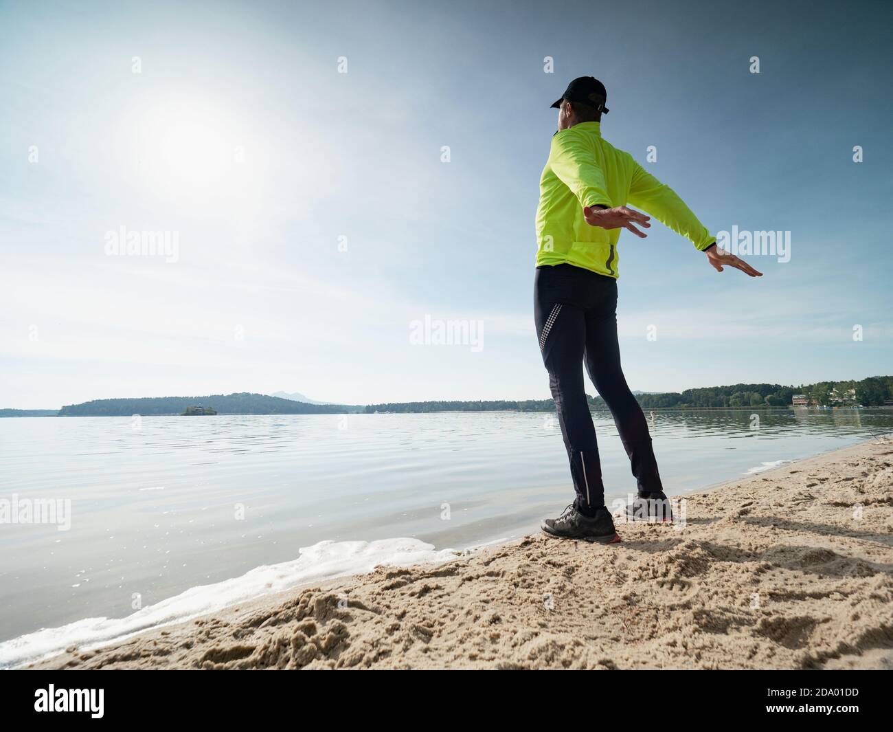 Back view sportsman stretching hi-res stock photography and images - Alamy