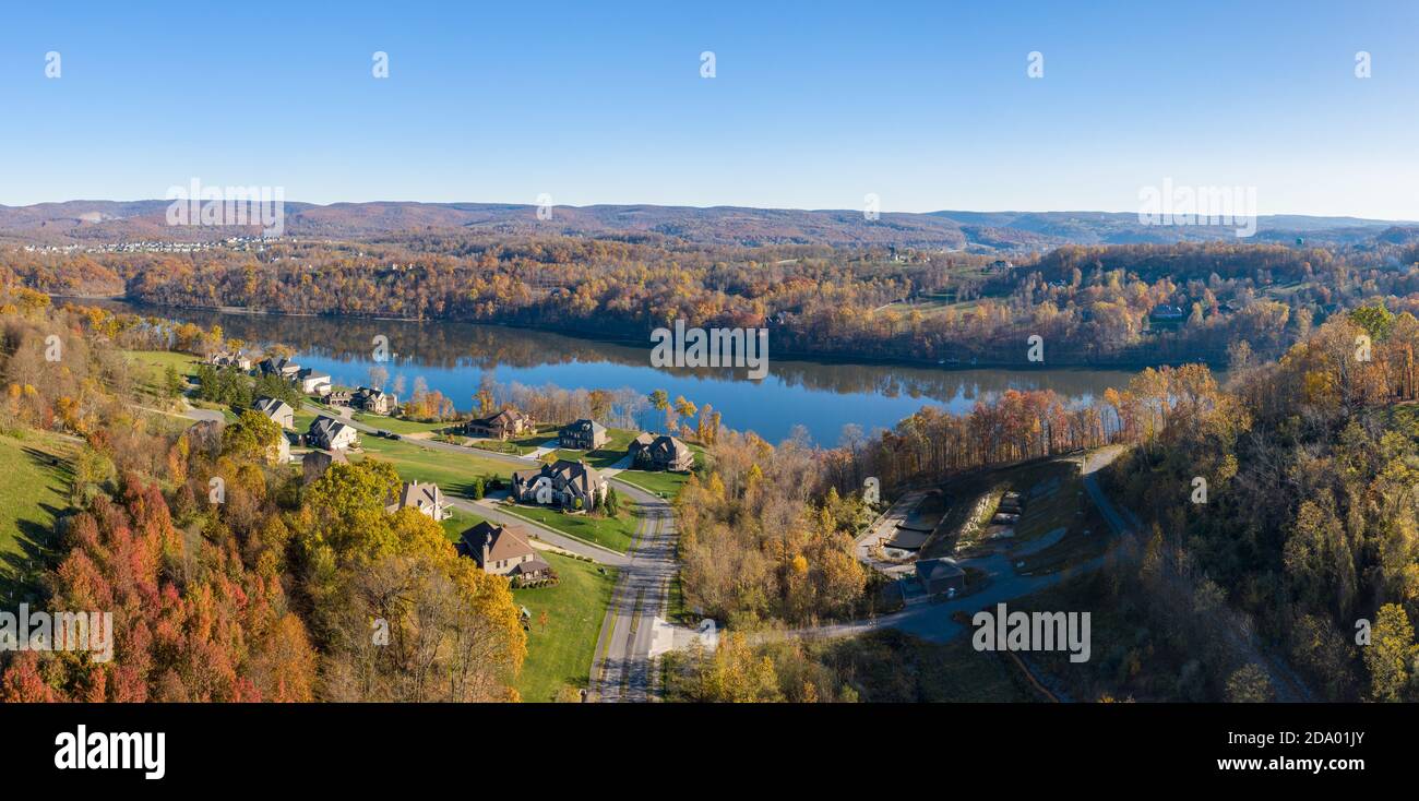 Aerial drone panorama of single family houses by Cheat Lake near Morgantown in autumn Stock Photo