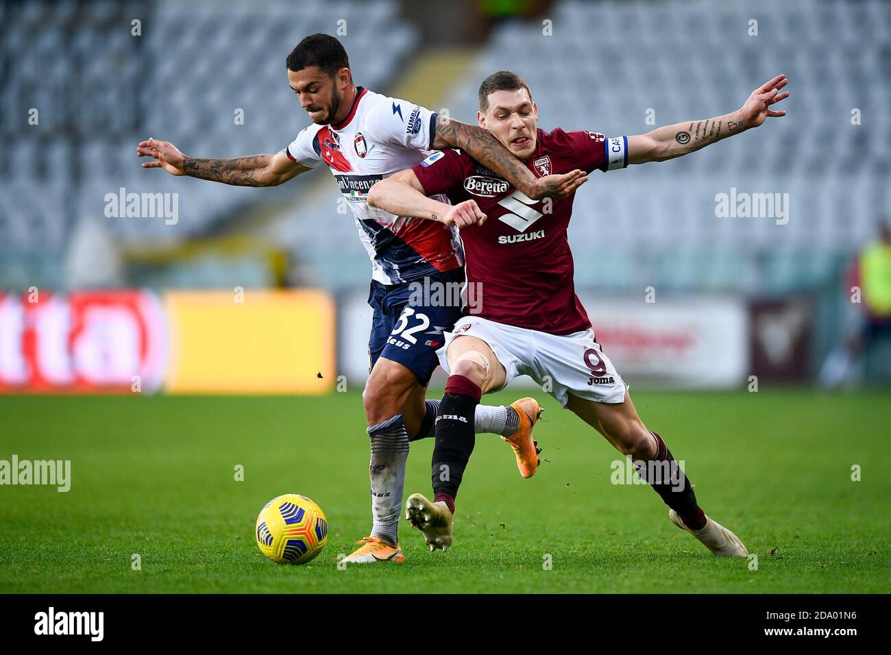 Turin, Italy. 08th Nov, 2020. TURIN, ITALY - November 08, 2020: Andrea Belotti of Torino FC is challenged by Pedro Pereira of FC Crotone during the Serie A football match between Torino FC and FC Crotone. (Photo by Nicolò Campo/Sipa USA) Credit: Sipa USA/Alamy Live News Stock Photo