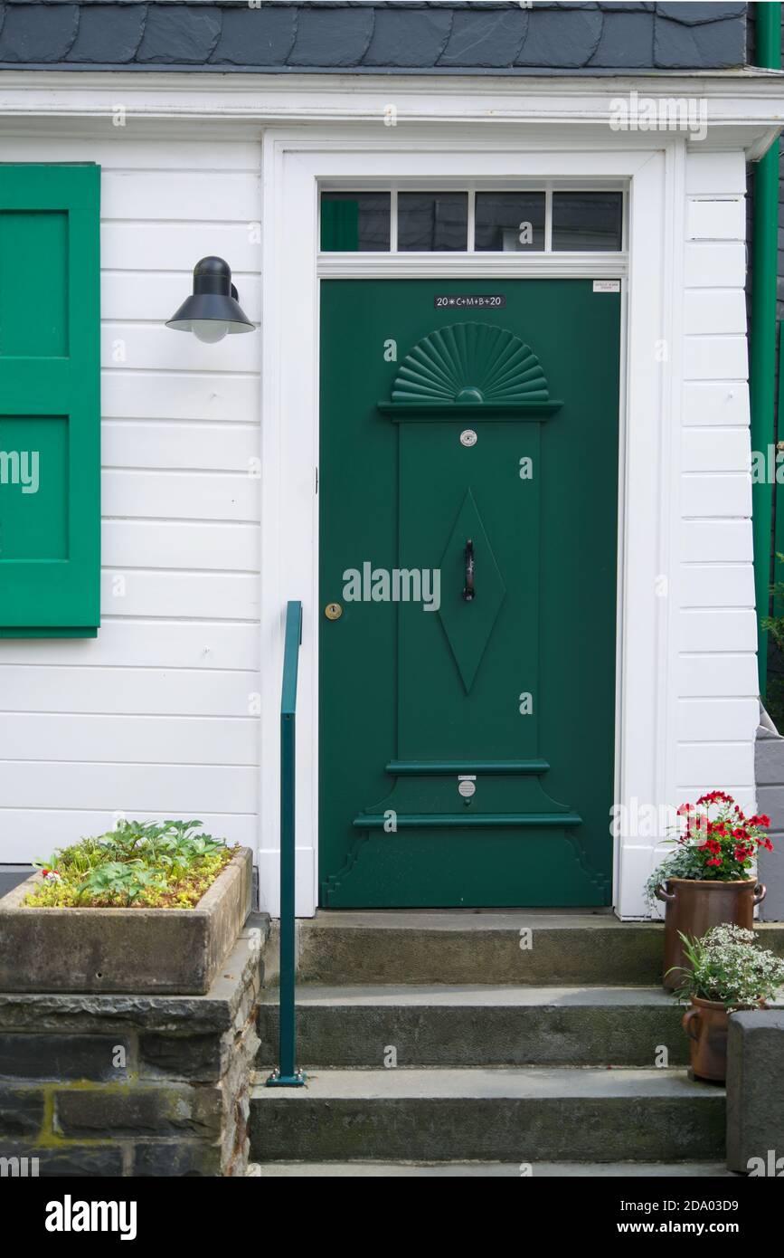 Green door of a traditional white house Stock Photo - Alamy